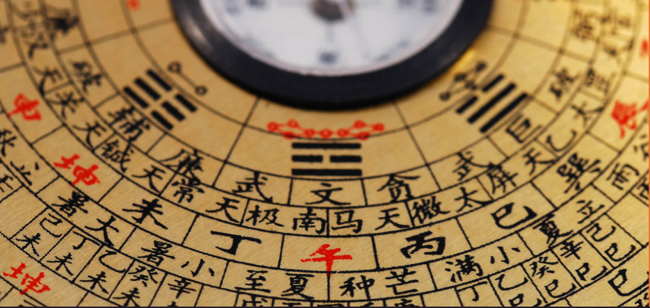 A master of classical Feng Shui uses a compass